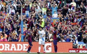 REFILE - CORRECTING WORD ORDER IN STADIUM'S NAME Barcelona's Lionel Messi (L) celebrates his goal with teammate Rafinha as Deportivo de la Coruna's Canela (C) reacts during their Spanish first division soccer match at Camp Nou stadium in Barcelona, Spain, May 23, 2015.  . REUTERS/Gustau Nacarino