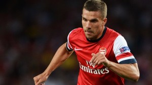 LONDON, ENGLAND - AUGUST 27:  Lukas Podolski of Arsenal runs with the ball during the UEFA Champions League Play Off Second leg match between Arsenal FC and Fenerbahce SK at Emirates Stadium on August 27, 2013 in London, England.  (Photo by Michael Regan/Getty Images)