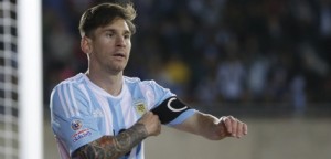 Argentina's Lionel Messi adjustes his captain bracelet during a Copa America Group B soccer match at La Portada stadium in La Serena, Chile, Saturday, June 13, 2015. (AP Photo/Ricardo Mazalan)