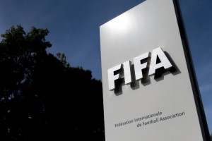 The logo of the global football's governing body FIFA is seen on October 3, 2013 at its headquarters in Zurich. FIFA kicked off a crunch meeting behind closed doors, amid claims of rights abuses by 2022 World Cup Qatar and wrangling over plans to hold the tournament in the winter.  AFP PHOTO / FABRICE COFFRINI