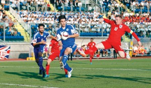 Football - San Marino v England - UEFA Euro 2016 Qualifying Group E - Stadio Olimpico, Serravalle, San Marino - 5/9/15 San Marino's Cristian Brolli (not pictured) scores an own goal for England's second as England's Wayne Rooney stretches for the ball  Action Images via Reuters / Carl Recine Livepic EDITORIAL USE ONLY.